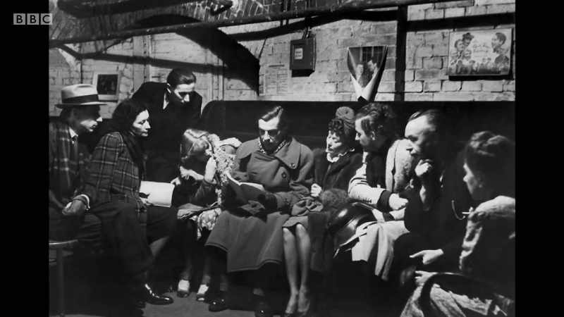 In the basement, the minister performs a brief service