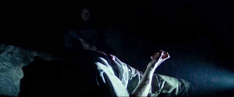In the dark, a guy alone being watched over