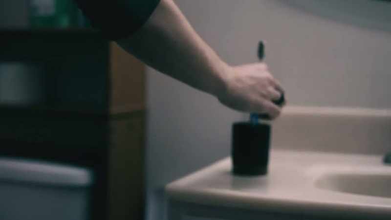 In the half bathroom, there's a cup