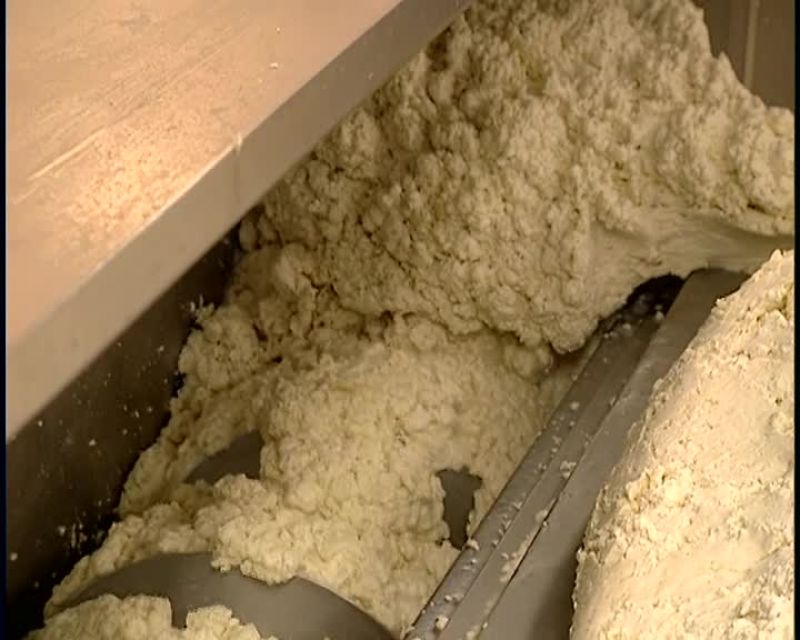 IN THE MOLDER, THE CHEESE IS CUT UP