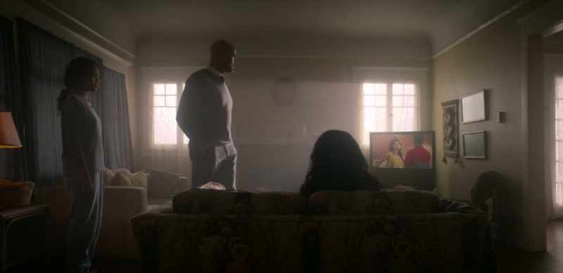 [indistinct chatter on TV]