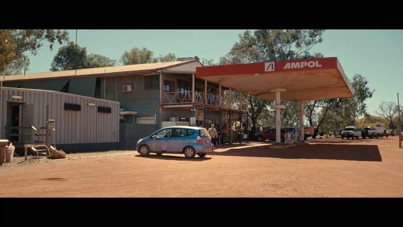 (INDISTINCT CONVERSATIONS) - (TRUCK HORN BLOWS NEARBY)
