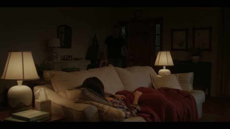 [indistinct dialogue over TV]