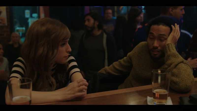 [indistinct TV chatter]