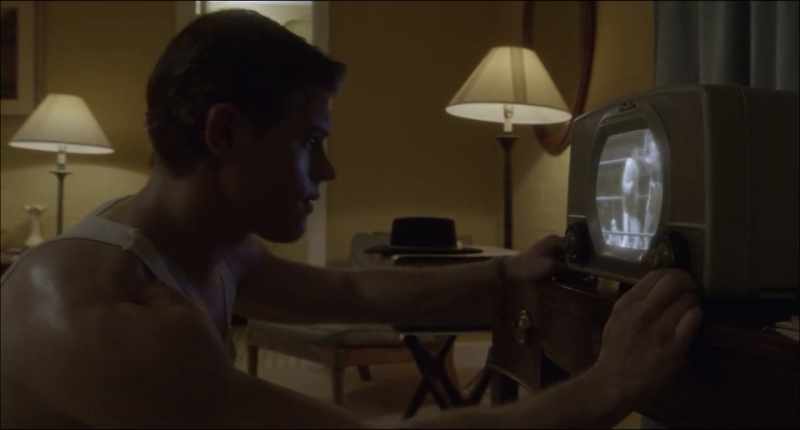 (indistinct tv chatter)