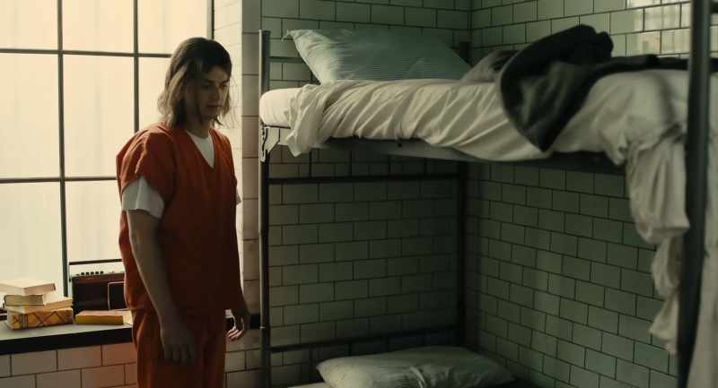 (inmates chatter distantly)