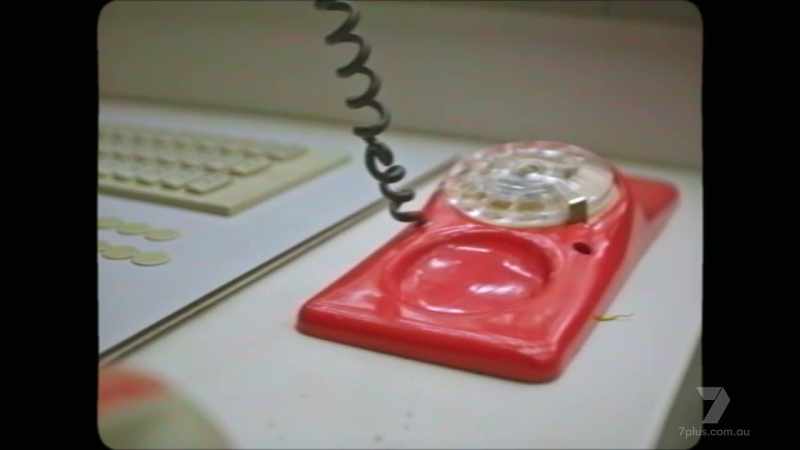 Inside the control room, the phone rings