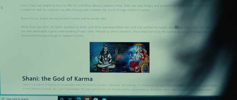It says that the statue is the God Shani