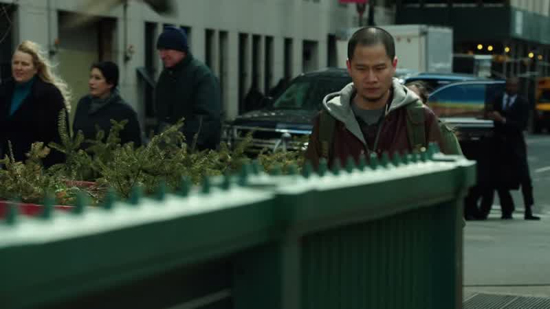 There! Right there! He's wearing the same jacket in the picture from his apartment. He's heading dow