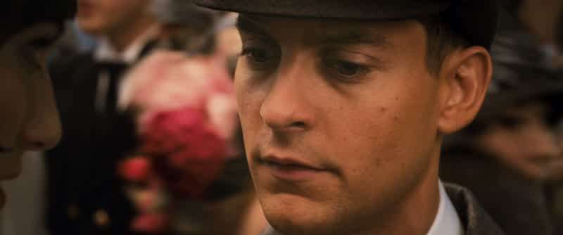 It's a strange coincidence What isThe fact that Gatsby's house is just across the bayIt's no coincidenceHe bought that house to be near herHe threw all those parties hoping she'd wander in one nightHe