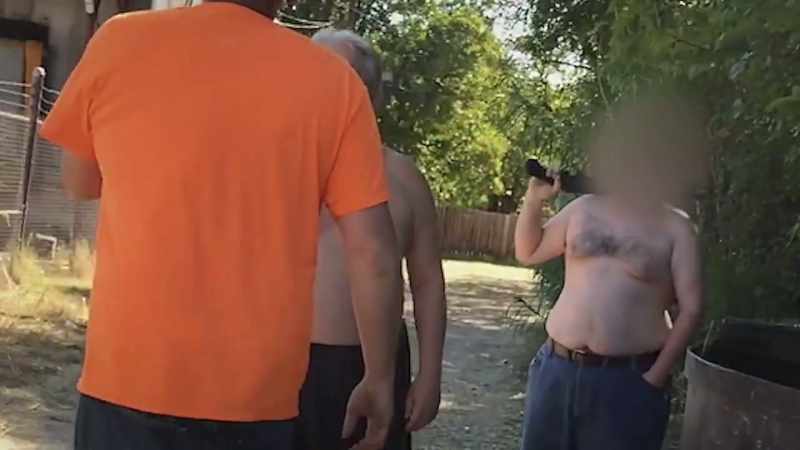 It's her partner, Aaron Howard, in the orange shirt