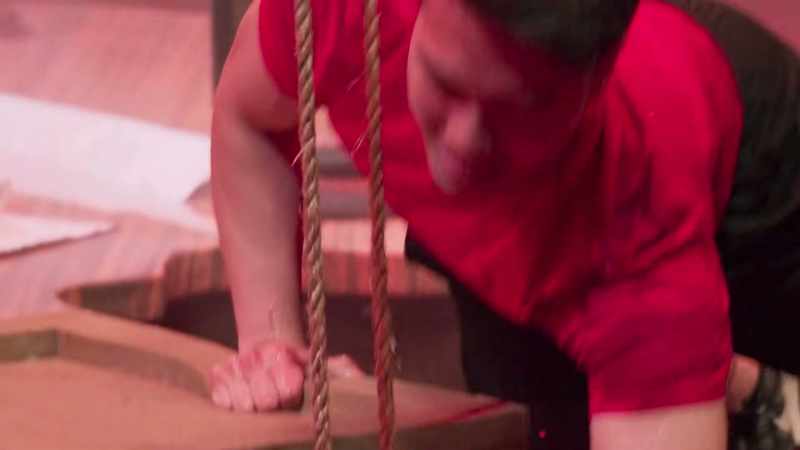 Jerry, cranking furiously while his frat brothers watch