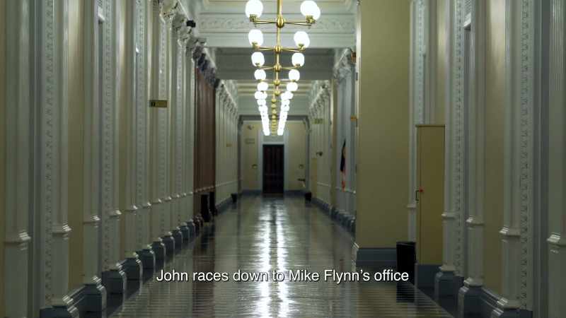 John races down to Mike Flynn's office