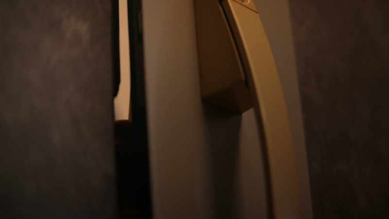 Just before seven o'clock, the door opened