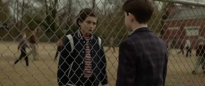 [kicks ball against fence]