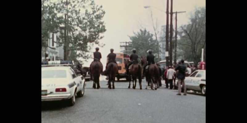[Larry] That bus would pull up. They was throwing rocks and sticks at our bus