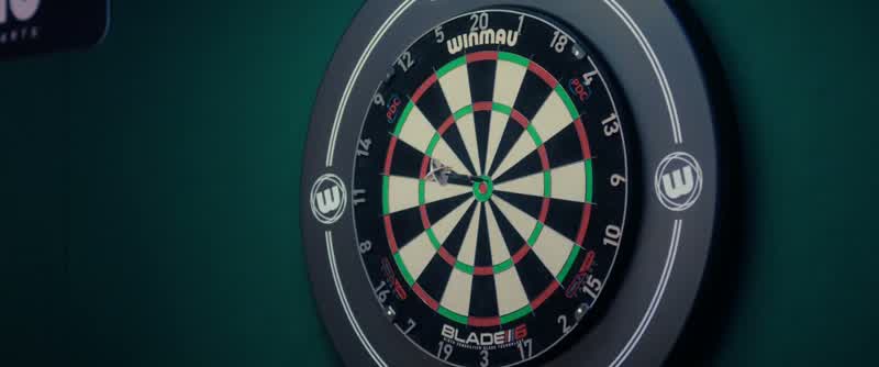 Last dart just misses