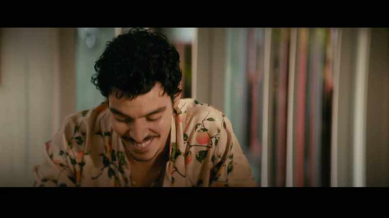 (Latin guitar music) (people chatter indistinctly)