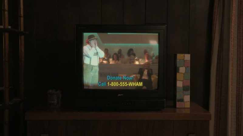 [laughter over TV]