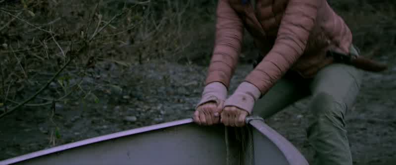 Lay down on the bottom of the boat
