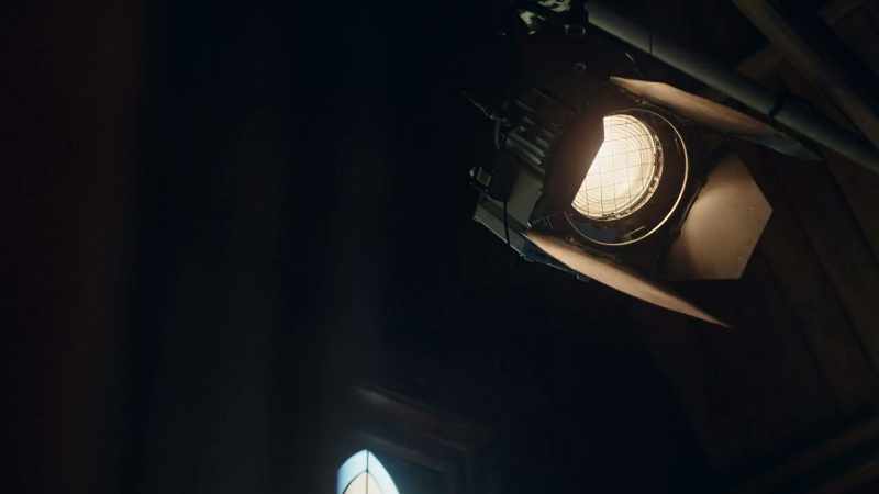 [Lights humming]