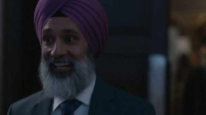 [lively bhangra music playing]