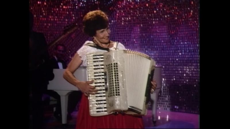 [Loud, discordant polka music]