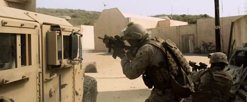 (machine gun firing)