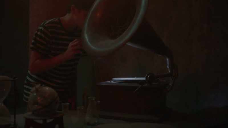 Man on phonograph: This record