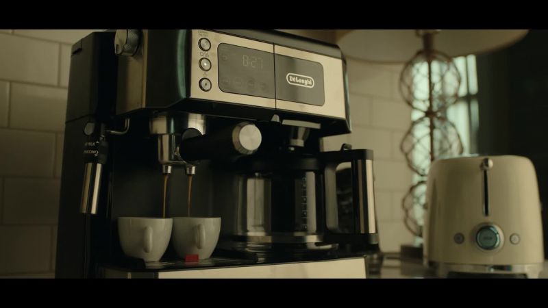 [man over coffee machine] It's 8:27