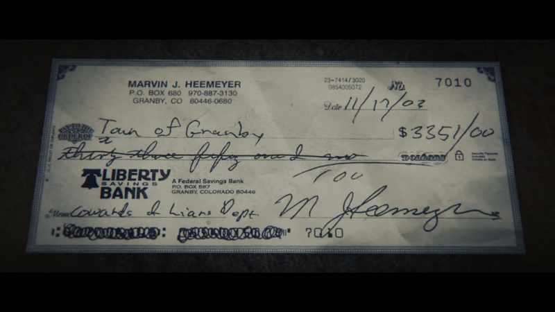 Marv corrects the verbiage on the check