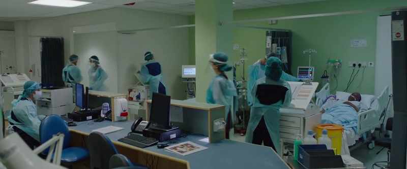 (medical staff chattering)