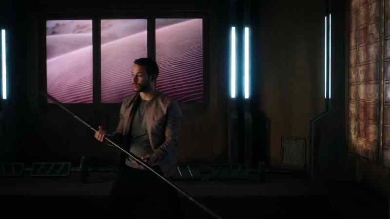 [mimics sword slashing]