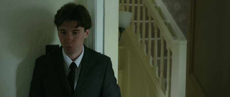 [mourners murmuring]
