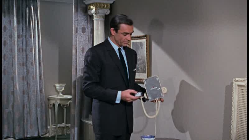 Mr. Bond here. - Yes? - The room won't do. - I'm sorry. The bed's too small. One moment, sir. Did