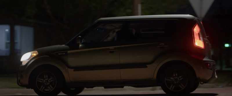[muffled music from car radio]