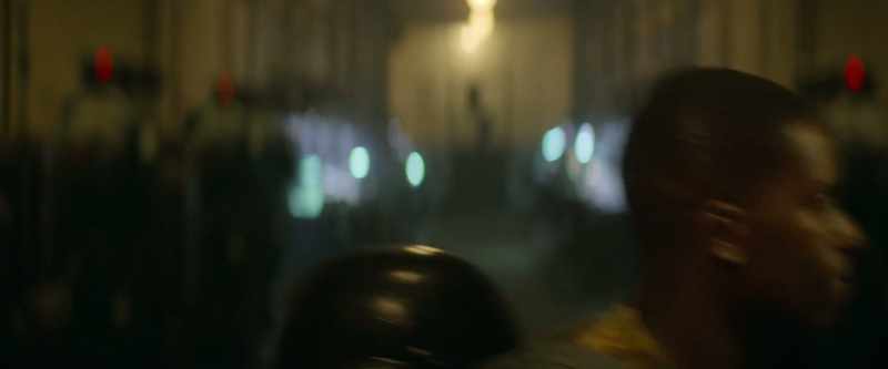 [muffled music plays]