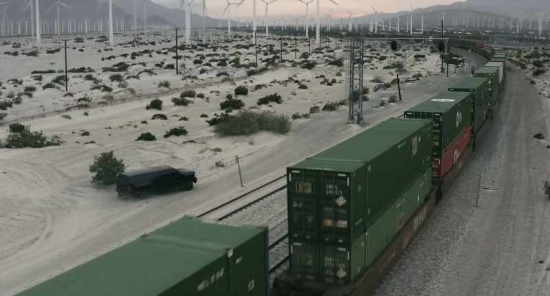 (music continues) (train rattling)