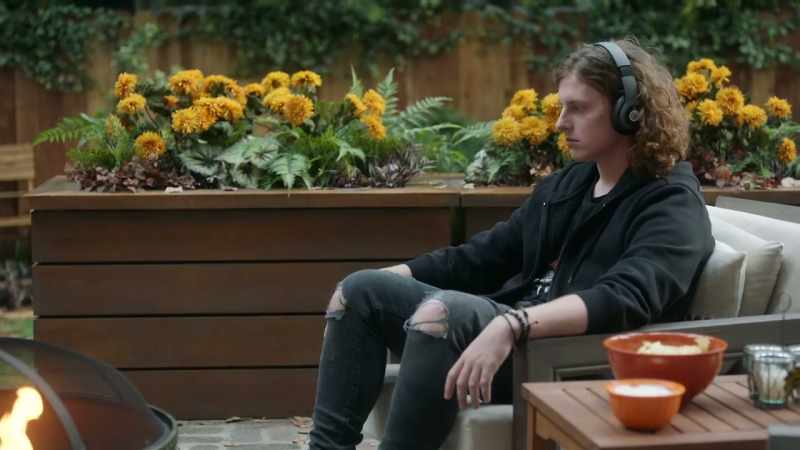 [music playing over headphones]
