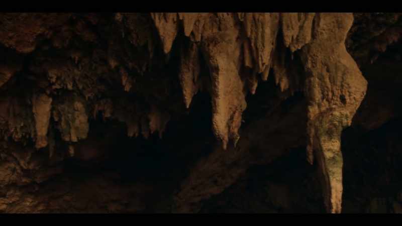 (mysterious music) (water dripping)