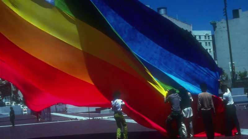 Narrator: A giant version of the flag