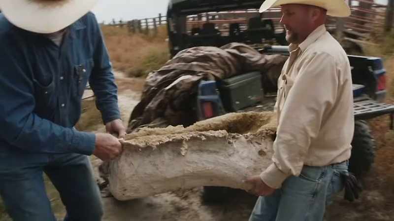 Narrator: AFTER EXCAVATING AN ENORMOUS TRICERATOPS