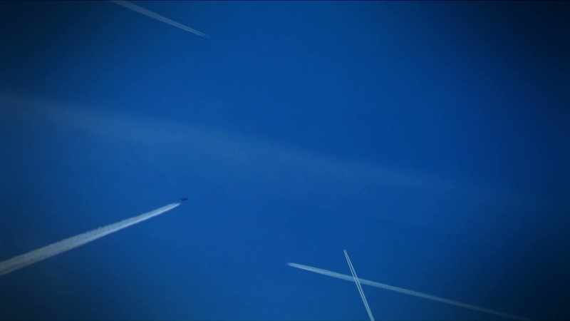 Narrator: CONTRAILS ARE THIN, LINEAR CLOUDS