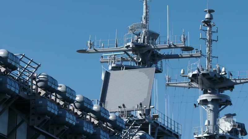 Narrator: Crew aboard the uss forrestal