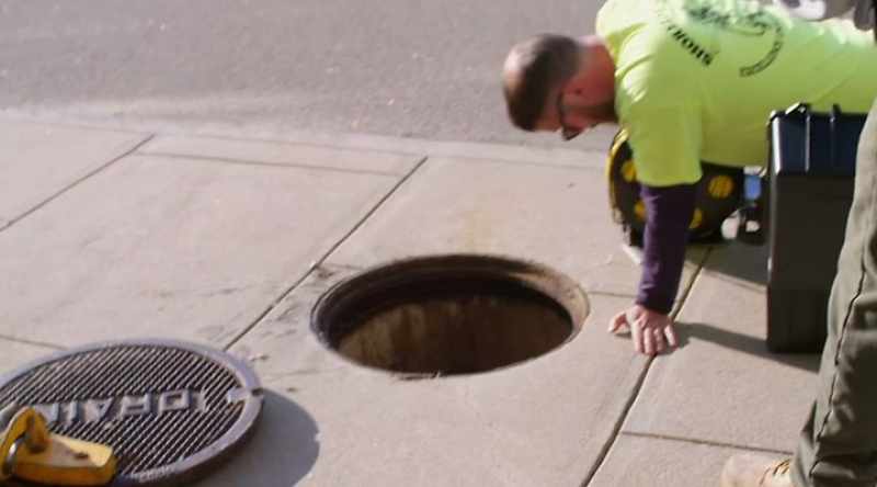 [narrator] Finding a clog beneath the parking garage