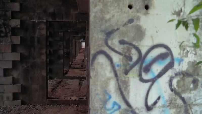 [narrator] Graffiti-littered terraces