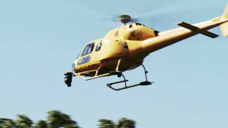 Narrator: HELICOPTER SURVEILLANCE CAMERAS CAPTURE