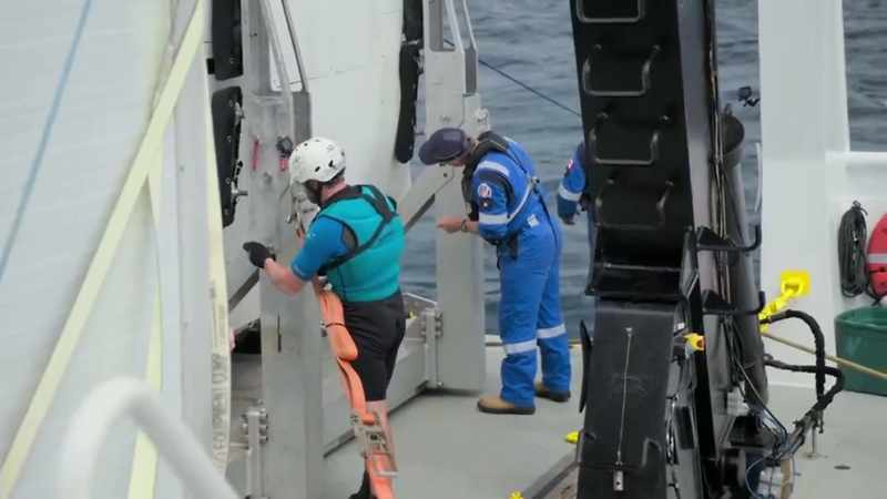 Narrator: The team is preparing the sub for the next dive