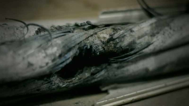 Narrator: THESE CORRODED CABLES SMOLDER