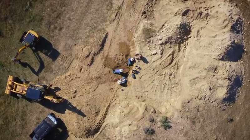 Narrator: THEY EXPOSED THE BONE LAYER WITH THEIR HEAVY MACHINERY